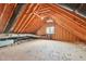 Spacious attic with exposed wooden beams, open floor, and window at 231 Heather Bluffs Dr, Garner, NC 27529