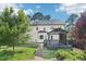 Manicured backyard with mature trees, patio and lush landscaping create a private, relaxing space at 231 Heather Bluffs Dr, Garner, NC 27529
