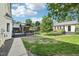 Backyard with a gazebo, walkway, landscaping, and a view of a guest house adding value at 231 Heather Bluffs Dr, Garner, NC 27529
