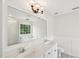 Bright bathroom features double vanity, tile floors, and walk-in shower at 231 Heather Bluffs Dr, Garner, NC 27529