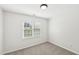 Bedroom has neutral paint and carpet and a bright window to the outside at 231 Heather Bluffs Dr, Garner, NC 27529