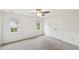Bright bedroom with neutral walls, gray carpet, and two windows providing natural light at 231 Heather Bluffs Dr, Garner, NC 27529