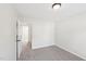 This bedroom has neutral paint and carpet with views to an adjacent room at 231 Heather Bluffs Dr, Garner, NC 27529