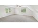Bright bedroom features two large windows, neutral walls, and carpeted floor at 231 Heather Bluffs Dr, Garner, NC 27529