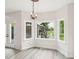 Cozy breakfast nook featuring a chandelier, hardwood floors, and a view of the backyard at 231 Heather Bluffs Dr, Garner, NC 27529