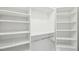 Walk-in closet with white shelving offering ample storage space at 231 Heather Bluffs Dr, Garner, NC 27529
