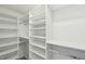Spacious walk-in closet with custom shelving and ample storage options at 231 Heather Bluffs Dr, Garner, NC 27529