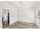 Dining room features modern chandelier, wainscoting and wood-look floors at 231 Heather Bluffs Dr, Garner, NC 27529