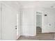 Spacious foyer with wood-look floors, white wainscoting and large front door at 231 Heather Bluffs Dr, Garner, NC 27529