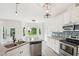Beautiful kitchen with stainless appliances, granite countertops and a view of the backyard at 231 Heather Bluffs Dr, Garner, NC 27529