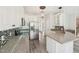 Updated kitchen with stainless steel refrigerator, granite counters and mosaic backsplash at 231 Heather Bluffs Dr, Garner, NC 27529