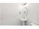 Powder room features modern mirror, fixtures, sink and shiplap at 231 Heather Bluffs Dr, Garner, NC 27529