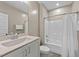 This bathroom has a functional vanity, modern faucet, toilet, and bright shower at 2500 Plowridge Rd, Fuquay Varina, NC 27526