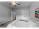 This bedroom features a ceiling fan, closet with doors, and a bright neutral color scheme at 2500 Plowridge Rd, Fuquay Varina, NC 27526