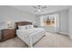 Bright bedroom features a ceiling fan, plush carpet and a large window at 2500 Plowridge Rd, Fuquay Varina, NC 27526