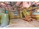 Unfinished basement with brick foundation, exposed utilities, and wooden staircase at 2602 Francis St, Durham, NC 27707