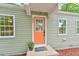 Close-up of the front door with modern updates, new paint, and a welcoming entrance at 2602 Francis St, Durham, NC 27707