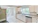Updated kitchen features granite countertops, stainless steel appliances, and bright natural light at 2602 Francis St, Durham, NC 27707