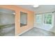 Bright open-concept living room boasting modern colors, neutral carpet, and large windows at 2602 Francis St, Durham, NC 27707