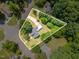 Aerial view of a property with an outlined perimeter, showcasing the expansive lot surrounded by mature trees at 2714 Wedgedale Ave, Durham, NC 27703