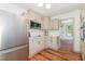 Updated kitchen features stainless steel appliances and custom cabinetry at 2714 Wedgedale Ave, Durham, NC 27703
