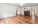 Spacious living room featuring wood floors and a charming brick fireplace at 2714 Wedgedale Ave, Durham, NC 27703