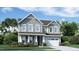 Charming two-story home featuring gray siding, white trim, and a well-manicured front yard at 2964 Hanging Valley Way, Wake Forest, NC 27587