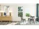 Well-lit dining area with a round table, elegant decor, and access to the outdoors at 2968 Hanging Valley Way, Wake Forest, NC 27587