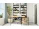 Functional home office space featuring a stylish desk, modern shelving, and a comfortable chair at 2968 Hanging Valley Way, Wake Forest, NC 27587