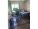 Bedroom area, with a window, desk, gaming chair, and wood-look flooring at 3000 Centennial Woods Dr # 302, Raleigh, NC 27603