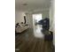 Bright living room features wood-look flooring and a ceiling fan at 3000 Centennial Woods Dr # 302, Raleigh, NC 27603
