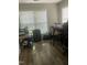 Bright office space with hardwood-look flooring and natural light from two windows at 3000 Centennial Woods Dr # 302, Raleigh, NC 27603