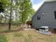 Large backyard view, deck, mature trees, attractive landscaping, rock creek bed and privacy at 306 Roebling Ln, Cary, NC 27513