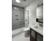 Modern bathroom features subway tile shower with glass door, hexagon tile floor, and stylish vanity with sink at 306 Roebling Ln, Cary, NC 27513