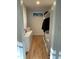 Walk-in closet with custom shelving, drawers, and hardwood floors at 306 Roebling Ln, Cary, NC 27513