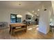 Open dining area with hardwood floors, modern lighting, and seamless flow into kitchen at 306 Roebling Ln, Cary, NC 27513