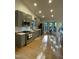 Modern kitchen with stainless steel appliances, gray cabinets, and bright, open layout at 306 Roebling Ln, Cary, NC 27513