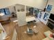 Bright, open living space featuring hardwood floors, modern kitchen, and cozy seating area at 306 Roebling Ln, Cary, NC 27513