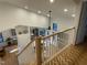 View of the living room and kitchen area from the top of a staircase at 306 Roebling Ln, Cary, NC 27513