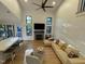 Spacious living room with hardwood floors, fireplace, and seamless flow to the outdoor deck at 306 Roebling Ln, Cary, NC 27513