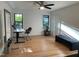 Bright office with hardwood floors, ceiling fan, desk, bench and natural light at 306 Roebling Ln, Cary, NC 27513