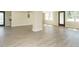Finished basement features light grey wood floors, neutral walls, and multiple windows at 316 Barbour St, Clayton, NC 27520