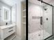 Luxurious bathroom featuring a glass shower, and modern vanity with marble-like tiling at 316 Barbour St, Clayton, NC 27520