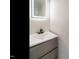 Bathroom featuring a modern sink with matte black faucet and a lighted mirror at 316 Barbour St, Clayton, NC 27520