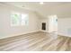 Bright bedroom with hardwood flooring, white walls, and natural light at 316 Barbour St, Clayton, NC 27520