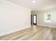 Bright bedroom featuring recessed lighting, wood floors, neutral paint, and a window at 316 Barbour St, Clayton, NC 27520