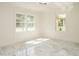 Sunlit bedroom features large windows, recessed lights, and marble flooring at 316 Barbour St, Clayton, NC 27520