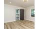 Spacious bedroom boasts wood floors, neutral paint, and an ensuite bath with a sleek vanity at 316 Barbour St, Clayton, NC 27520
