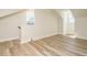 Bright bedroom with hardwood flooring, two windows, and neutral paint at 316 Barbour St, Clayton, NC 27520