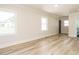 Bright bedroom featuring recessed lighting, wood floors, neutral paint, and multiple windows at 316 Barbour St, Clayton, NC 27520